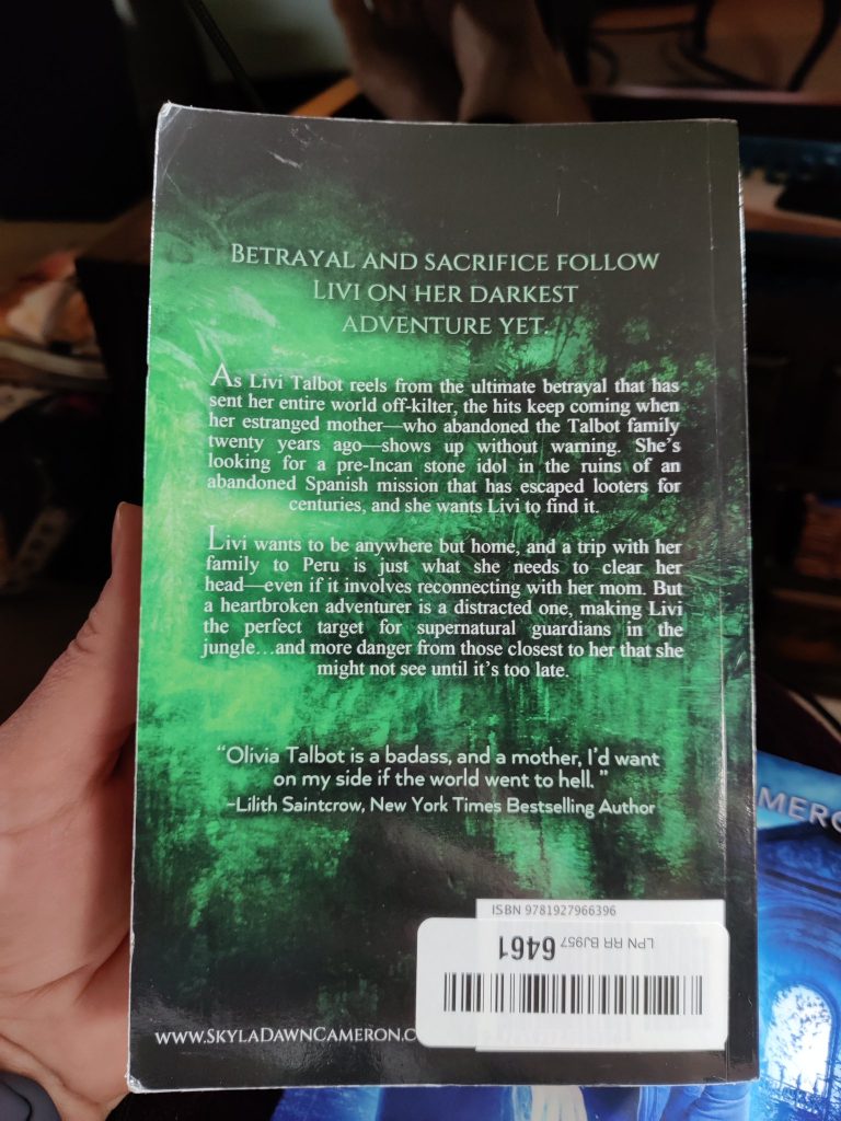 A roughed up paperback book with a return sticker.