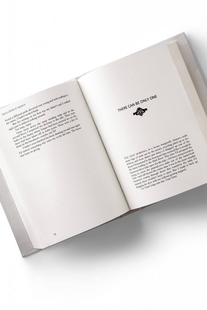 A 3D Mockup of a book's interior showing the chapter break and new chapter. The new chapter opens with a decorative lock graphic below the chapter header.